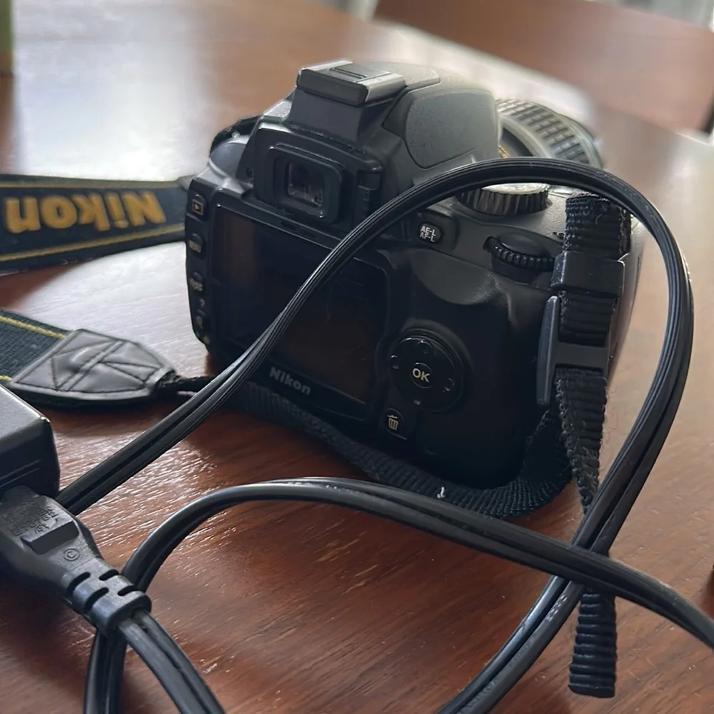 Nikon D60 digital camera with 4GB memory card, lens, battery, & charger included